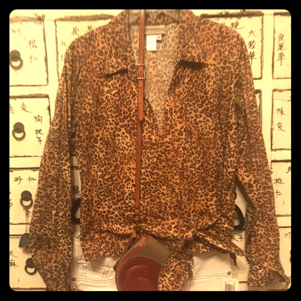 Animal print top ties to the left